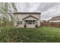 Spacious backyard with lush green grass and mature trees, perfect for outdoor activities at 1015 Supernova Dr, Franklin, IN 46131