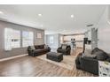 Open-concept living room showcasing luxury vinyl plank flooring and seamless flow into the kitchen at 10358 Pronghorn Ln, Indianapolis, IN 46239
