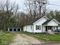 A quaint home with new roof and landscaping, and a detached three car garage at 1405 S Ribble Ave, Muncie, IN 47302