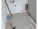Unfinished laundry room showing the plumbing access behind the wall at 1439 Elm St, Martinsville, IN 46151