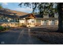 View of a home with a charming porch and an attached three-car garage at 15617 Westfield Blvd, Carmel, IN 46033