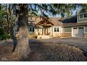 Inviting front entrance with a charming porch and rustic wooden accents at 15617 Westfield Blvd, Carmel, IN 46033