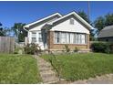 Inviting single-Gathering home with a brick foundation and a well-maintained front lawn at 1622 S Randolph St, Indianapolis, IN 46203