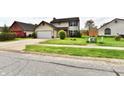 Charming two-story home with a well-manicured lawn and attached garage at 181 Tracy Ridge Blvd, Whiteland, IN 46184