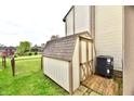 A well-maintained shed, great for storage, sits next to an AC unit at 181 Tracy Ridge Blvd, Whiteland, IN 46184