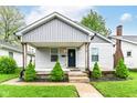 Cute covered front porch with updated columns and landscaping for added curb appeal at 319 S Randolph St, Indianapolis, IN 46201