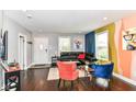 Stylish living room with modern décor, dark hardwood floors, and plenty of natural light at 319 S Randolph St, Indianapolis, IN 46201
