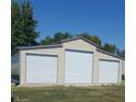 Spacious three car garage with a neutral color scheme and ample storage at 3348 W 800 N, Fairland, IN 46126