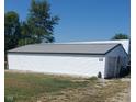 Exterior view of a white shed with a long, rectangular design and a gray metal roof at 3348 W 800 N, Fairland, IN 46126