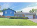 Charming two-story home featuring a well-maintained lawn and a spacious driveway at 3535 Ivory Way, Indianapolis, IN 46227