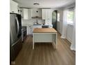 Beautifully renovated kitchen featuring stainless steel appliances and a functional island at 3864 Esquire Ct, Indianapolis, IN 46226
