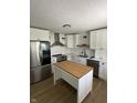 Beautifully renovated kitchen featuring stainless steel appliances and a functional island at 3864 Esquire Ct, Indianapolis, IN 46226