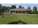View of backyard with deck, hot tub and large grassy area at 5607 E 500 N, Greenfield, IN 46140