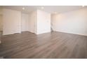 Open-concept living area with modern flooring and abundant natural light at 6216 Cascades Dr, Whitestown, IN 46075