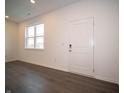 Bright living room featuring a window and sleek, modern flooring at 6216 Cascades Dr, Whitestown, IN 46075
