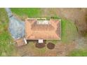 Aerial view showing the roof, detached garage, yard and driveway at 647 N 100 W, Franklin, IN 46131