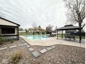 Resort-style backyard with in-ground pool, cabana, and lounge seating, perfect for entertaining at 6811 S Meridian St, Indianapolis, IN 46217