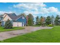 Spacious driveway leading to a two-car garage and a basketball hoop in the backyard at 7020 N 375 E, Lebanon, IN 46052