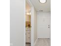 Stylish powder room features a vessel sink, marble countertop, and updated lighting fixtures at 7404 Countrybrook Dr, Indianapolis, IN 46260