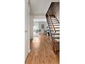 Inviting living space with hardwood floors and staircase at 7404 Countrybrook Dr, Indianapolis, IN 46260