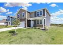 Charming two-story home with a well-manicured lawn and landscaping at 113 Hunter'S Rdg Dr, Danville, IN 46122