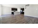 Spacious open-concept kitchen with stainless steel appliances and stylish dark cabinetry at 113 Hunter'S Rdg Dr, Danville, IN 46122