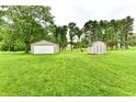 Expansive backyard featuring a detached garage and additional storage shed at 12087 N Gasburg Rd, Mooresville, IN 46158
