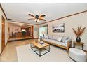 Elegant living room with hardwood floors and an open floor plan, seamlessly connecting to the kitchen at 12087 N Gasburg Rd, Mooresville, IN 46158