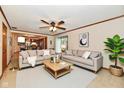 Inviting living room with neutral tones and an open concept to the kitchen at 12087 N Gasburg Rd, Mooresville, IN 46158