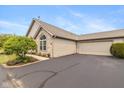 Charming home showcasing a well-maintained exterior, an attached garage, and paved driveway at 16637 Brownstone Ct, Westfield, IN 46074