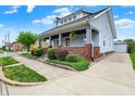 Corner lot featuring a well-manicured lawn, detached garage, and convenient driveway at 301 Colescott St, Shelbyville, IN 46176