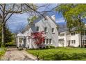 Beautiful home featuring a charming front porch and lush landscaping at 4134 N Pennsylvania St, Indianapolis, IN 46205