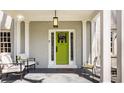 Inviting front porch with seating, offering a warm welcome at 4134 N Pennsylvania St, Indianapolis, IN 46205