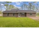 Charming single story brick home with a manicured green lawn and tidy landscaping at 5168 E Walnut Dr, Mooresville, IN 46158