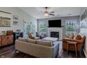 Inviting living room with a fireplace, neutral paint, stylish decor, and access to the backyard at 6195 Woodmill Dr, Fishers, IN 46038