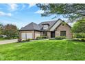 Well-maintained brick home with lush front yard and landscaping at 621 Thorne Dr, Brownsburg, IN 46112
