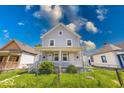 Traditional home boasting a fenced front yard and inviting covered entry at 625 Arbor Ave, Indianapolis, IN 46221