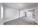 Bright living room showcasing hardwood floors and easy access to stairs at 625 Arbor Ave, Indianapolis, IN 46221