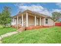 Inviting home with a welcoming front porch, a perfect spot to relax and enjoy the outdoors at 625 Maple St, Columbus, IN 47201