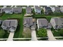 An aerial view of the neighborhood showcases the spacious backyards, landscaping, and neighborhood layout at 7824 Gray Eagle Dr, Zionsville, IN 46077