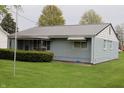 Charming single-story home featuring light blue siding and well-maintained landscaping at 8341 N Washington St, Sheridan, IN 46069