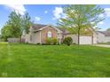 Lovely single-story home with a well-maintained lawn, brick details, and a two-car garage at 901 Palomino Pl, Bargersville, IN 46106