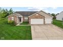 Charming single-story home with brick accents, two-car garage, and well-manicured lawn at 901 Palomino Pl, Bargersville, IN 46106