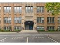 Exterior shot of a well-maintained brick building with prominent 'School 65' signage above the entrance at 920 E 62Nd St # Apt M7, Indianapolis, IN 46220