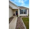 Inviting front entrance with tasteful landscaping and a welcoming door at 932 Sagittarius Ave, Franklin, IN 46131
