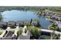 Beautiful aerial view of waterfront homes in a lakeside community, with mature trees and landscaping at 11484 Lake Stonebridge Ln, Fishers, IN 46037