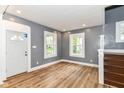 Bright living room with hardwood floors, neutral paint, and natural light through two windows at 1234 N Dearborn St, Indianapolis, IN 46201