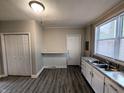 Open concept kitchen with breakfast bar, pantry and plentiful cabinets and counter space at 1303 9Th St, Columbus, IN 47201