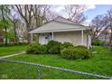 Charming single-story home features a cozy front porch and well-maintained landscaping at 1467 W 33Rd St, Indianapolis, IN 46208