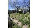 A spacious backyard with patio furniture and a small tool shed at 1525 Home Ave, Anderson, IN 46016